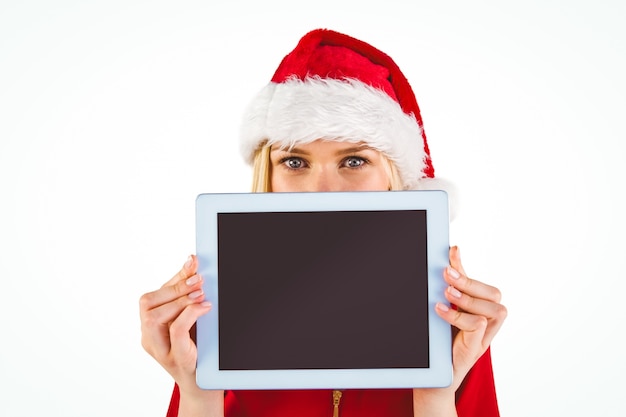 Blonde festive tenant un tablet pc