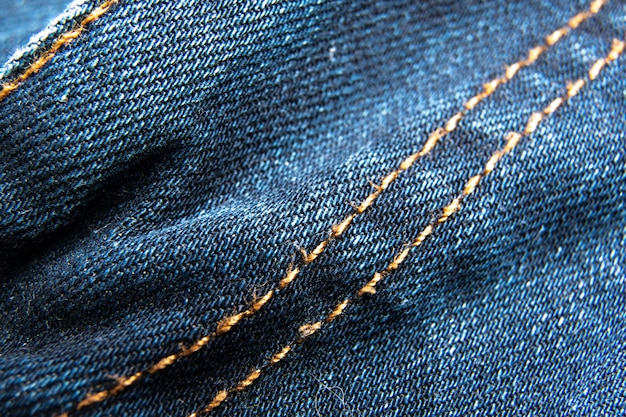 Blue jeans tissu macro couture motif de fond / Denim jeans texture / Blue jeans texture pour tout fond.