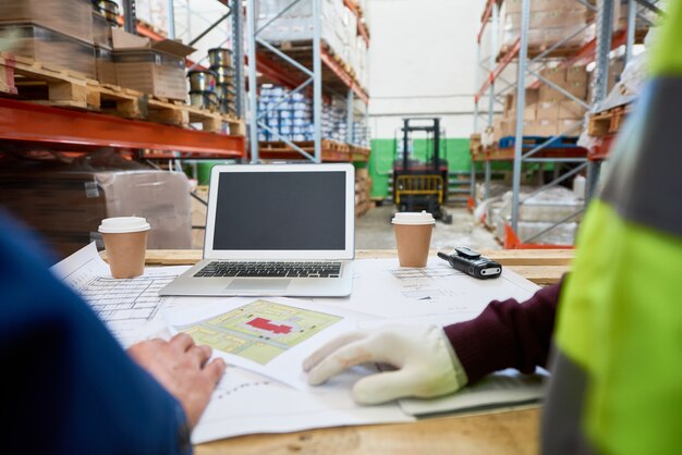 Photo blueprints at workers table