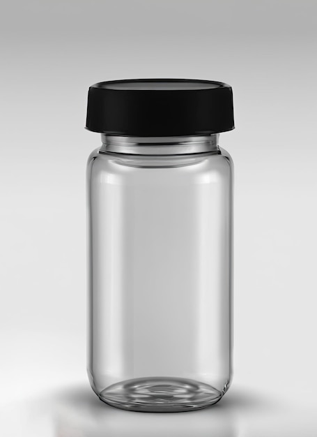 Un bocal en verre transparent avec un bouchon noir repose sur une surface blanche.
