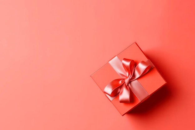 Boîte avec arc sur fond de couleur corail vue de dessus espace de copie célébrant les anniversaires de la Saint-Valentin Noël IA générative