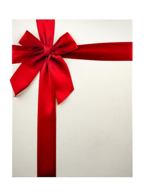 boîte en carton cadeau décorée d'un nœud de ruban de satin isolé