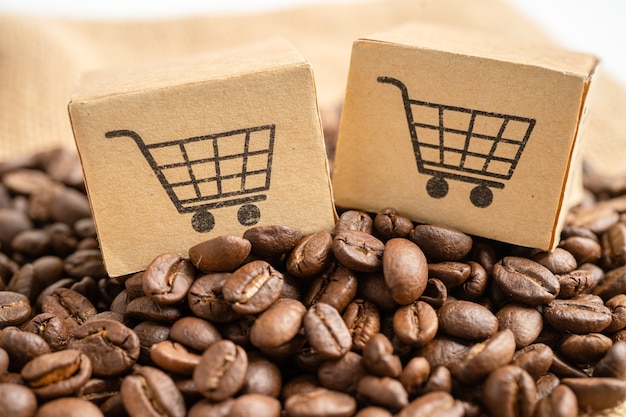 Boîte avec le symbole du logo du panier sur les grains de café Import Export Shopping en ligne