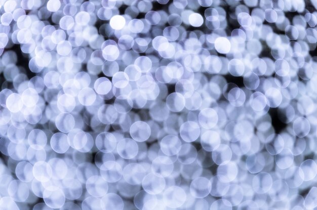 Bokeh, arrière-plan abstrait avec lumières scintillantes défocalisées.