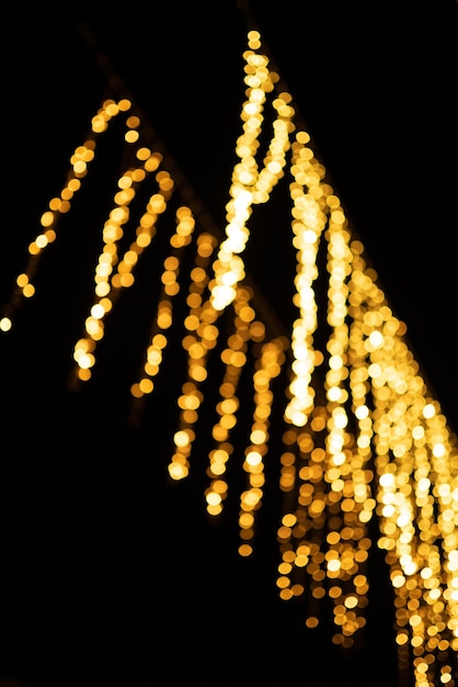 Bokeh de Noël abstrait en or sur fond noir