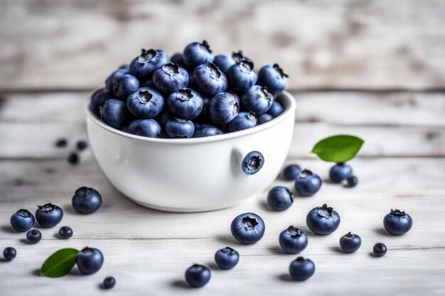 Photo un bol de bleuets est assis sur une table en bois