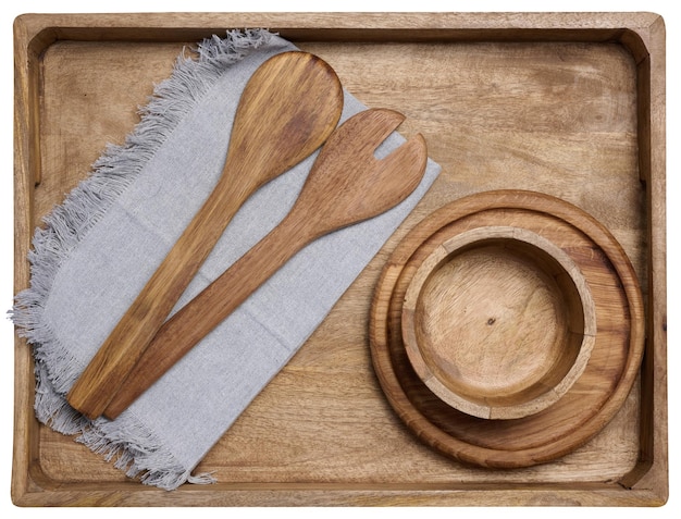 Photo un bol vide et des cuillères en bois sur une table noire