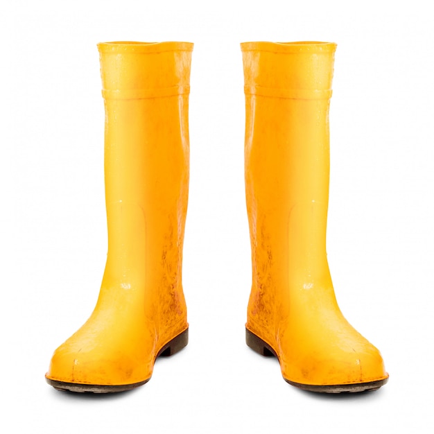 Bottes en caoutchouc jaune isolés sur fond blanc.