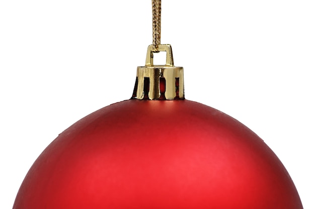 Bouchent la boule de Noël rouge sur la table