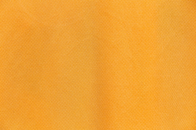 Bouchent le fond et la texture de tissu de tissu jaune.