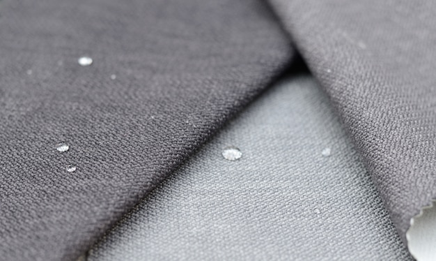 Bouchent La Goutte D'eau Sur Textile Gris Gunny. Concept Pour Des Surfaces Faciles à Nettoyer Et Imperméables