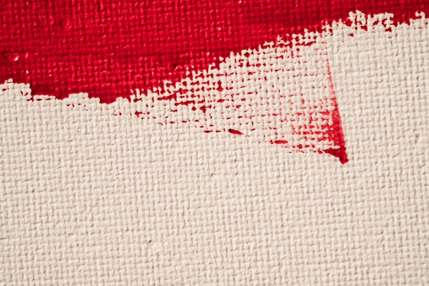 Bouchent la peinture de couleur rouge texture sur fond de toile blanche