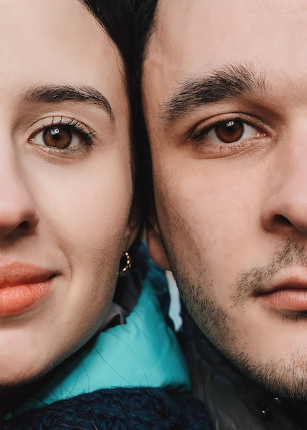 Photo bouchent le portrait de la moitié des visages homme et femme regardant la caméra.