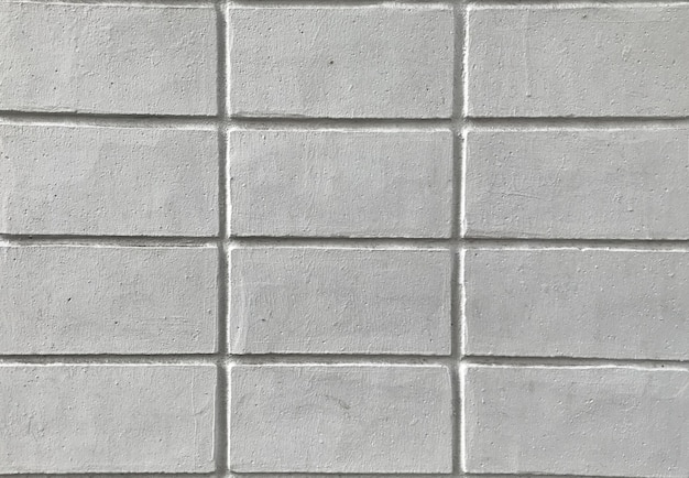 Bouchent la texture du mur de briques blanches pour le fond