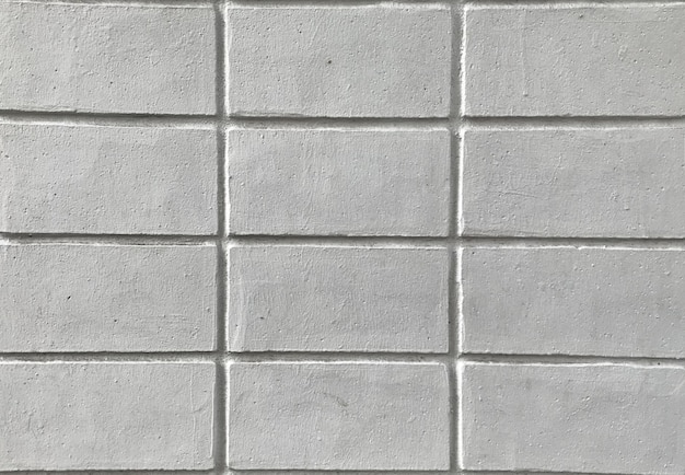 Bouchent la texture du mur de briques blanches pour le fond