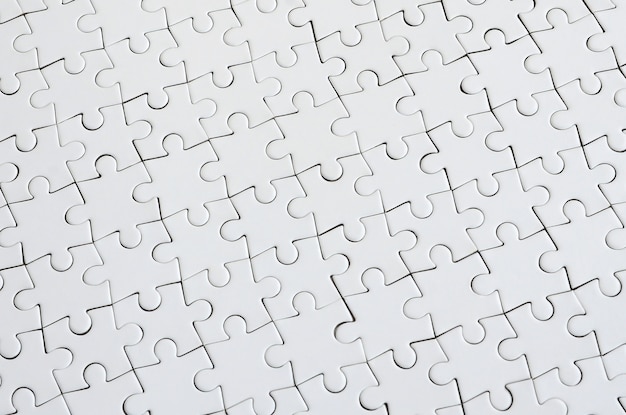 Bouchent la texture d&#39;un puzzle blanc en état assemblé.