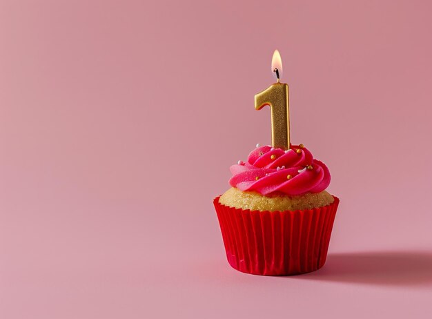 Photo la bougie numéro un sur un cupcake avec un espace de copie rose