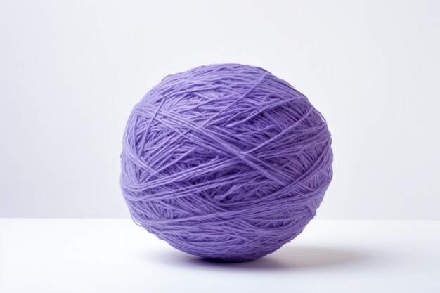 Photo boule de fil de couture violet sur fond blanc ia générative