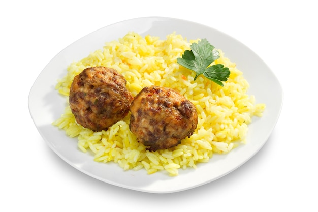 Boulettes de viande frites et riz sur assiette