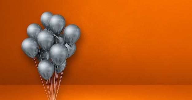 Bouquet de ballons argentés sur surface orange