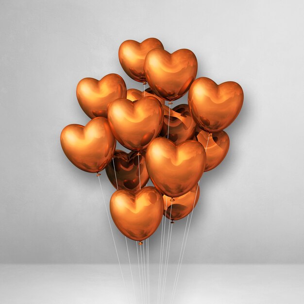 Bouquet de ballons en forme de coeur en cuivre sur un mur blanc. Rendu 3D