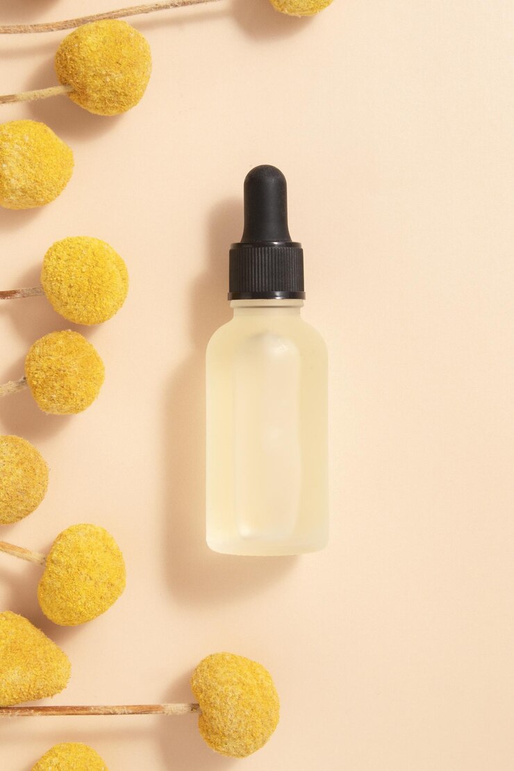 Bouteille de cosmétiques avec sérum avec extraits de fleurs de craspedia Cosmétiques pour le soin de la peau