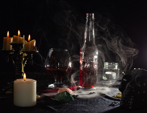 Photo une bouteille de liquide rouge comme du sang et un verre