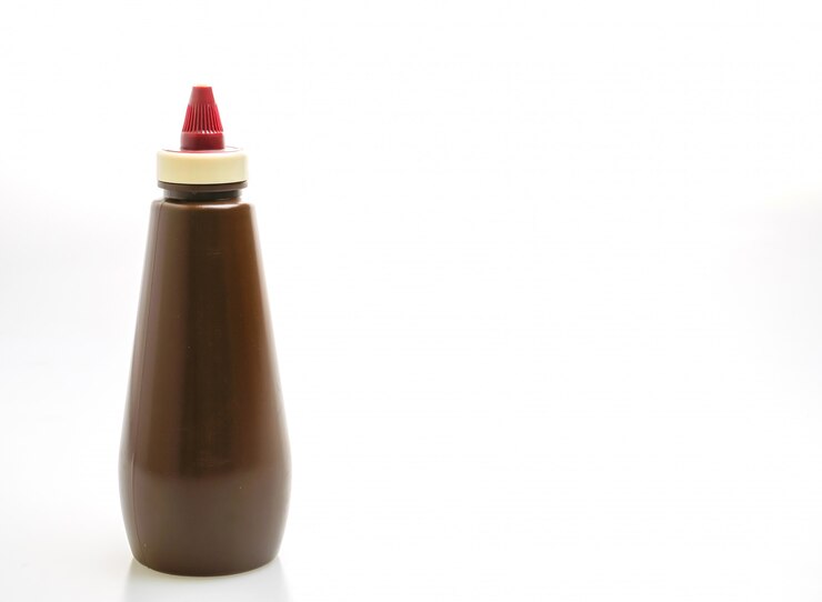 Photo bouteille de sauce barbecue isolé