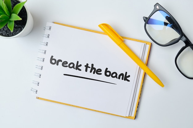 Break the bank - anglais argent idiome main lettrage