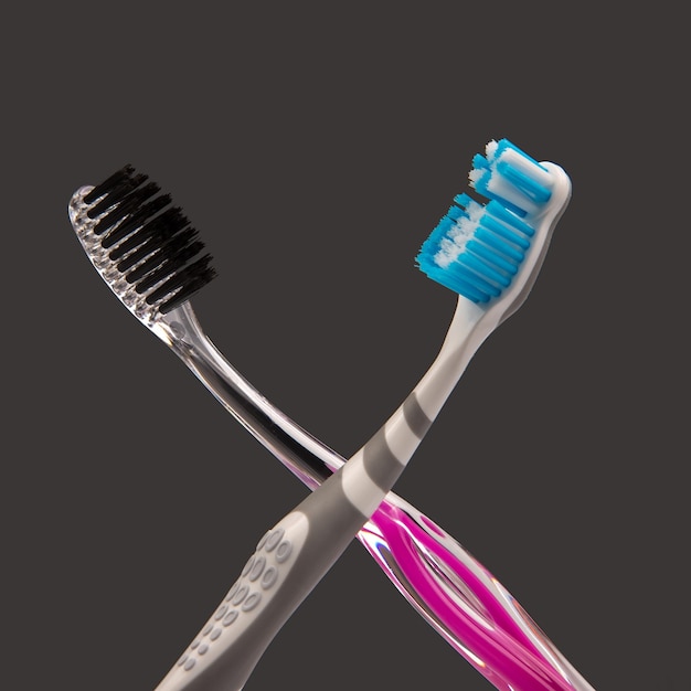 Brosse à dents pour nettoyer les dents sur un fond sombre articles de santé