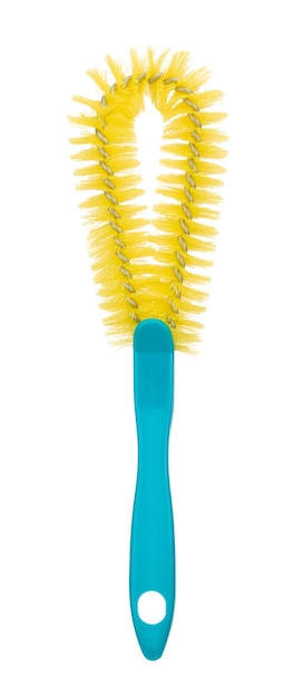 Photo brosse de nettoyage jaune pour verres bouteilles isolé sur fond blanc