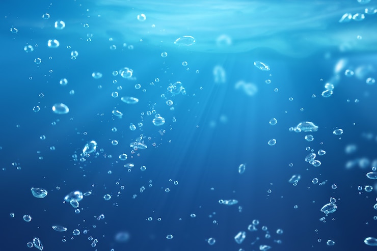 Photo bulles d'air sous le fond de la nature de l'eau