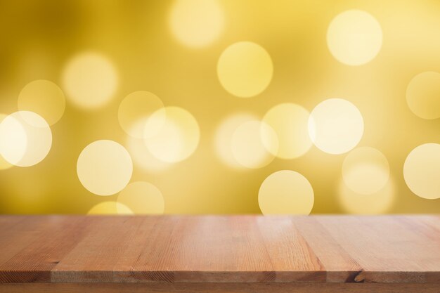 Bureau en bois avec des cercles de bokeh fond abstrait ton dégradé jaune pour le fond de Noël