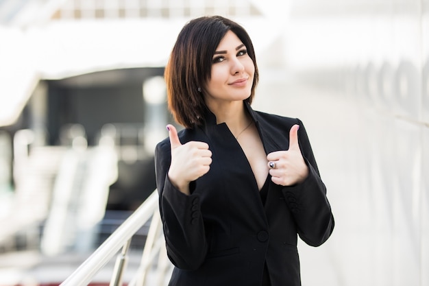 Businesswoman with Thumbs up in office