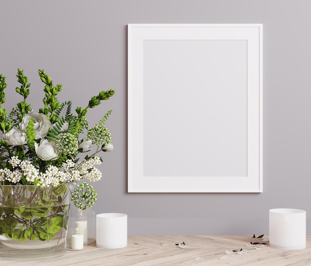 Cadre d'affiche de maquette gros plan sur un mur gris clair avec des fleurs blanches et des bougies de rendu 3D