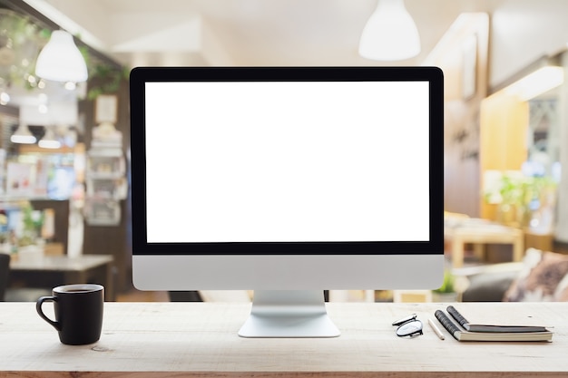 cadre de bureau ordinateur blanc sur la table de travail