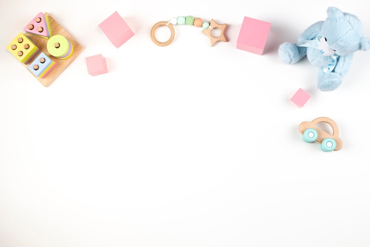 Photo cadre de jouets pour bébés et enfants sur fond blanc vue supérieure à plat espace de copie pour le texte