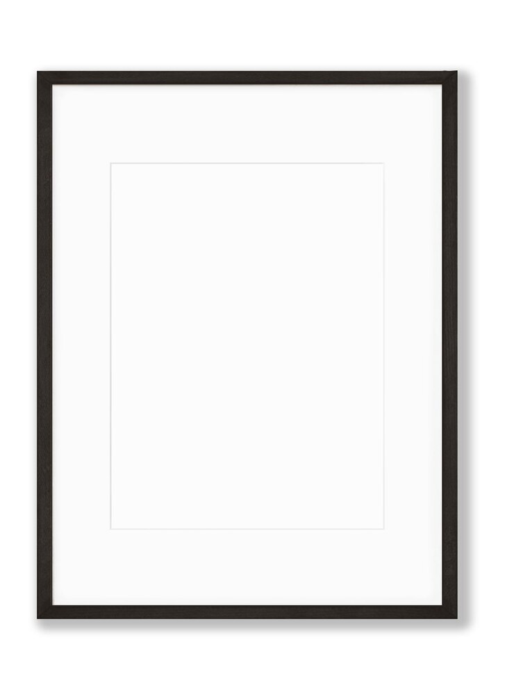 Photo un cadre noir avec une bordure blanche contre un mur blanc.