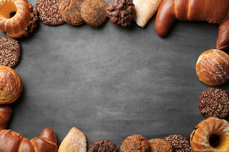 Photo cadre de pâtisseries fraîches assorties sur fond gris