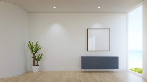 Cadre photo vide blanc vide et armoire sur le plancher en bois du salon lumineux dans la maison de plage