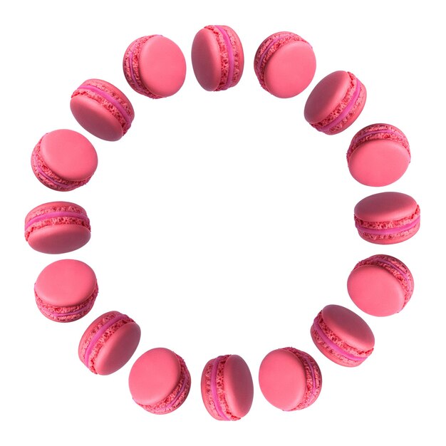 Cadre rond de gâteaux macarons français roses isolés sur fond blanc