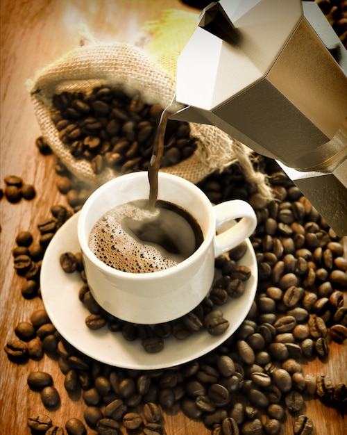 Cafetière avec tasse à café et grains de café