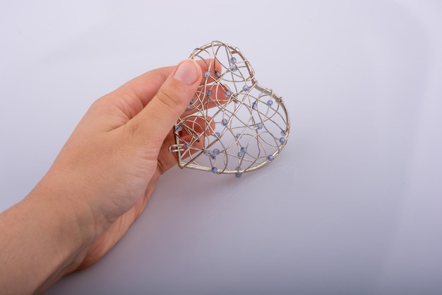 Cage en forme de coeur à disposition