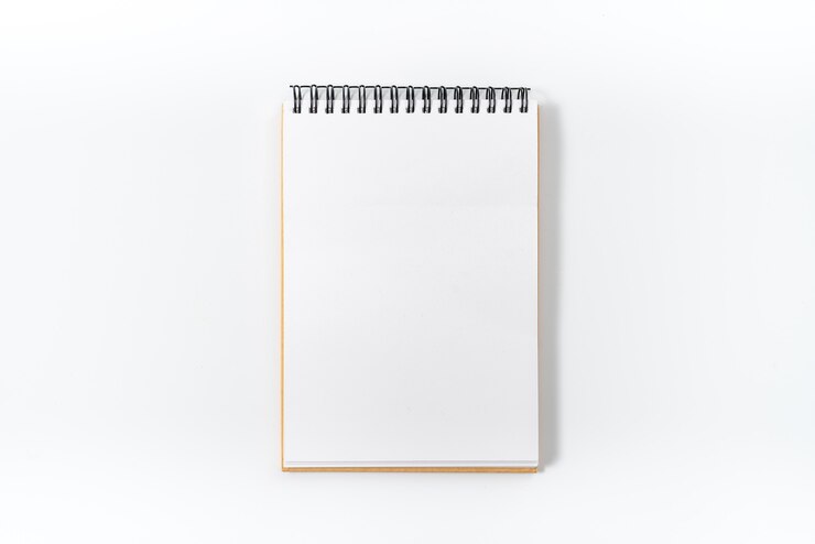 Photo cahier à spirale marron isolé sur fond blanc.vue de dessus