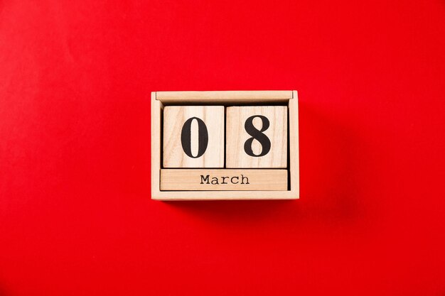 Photo calendrier de bloc en bois sur fond de couleur célébration de la journée internationale de la femme