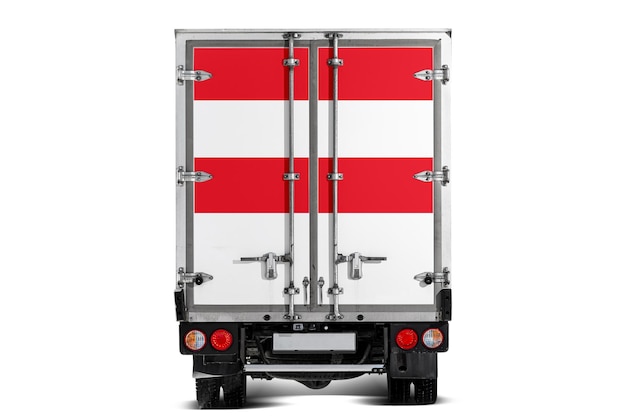 Photo un camion avec le drapeau national de l'autriche représenté sur le hayon roule sur un fond blanc concept de transport d'export-import livraison nationale de marchandises