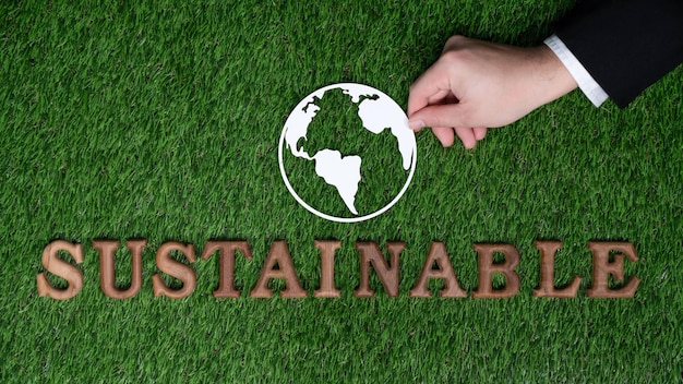 Campagne de sensibilisation écologique et écologique avec message texte arrangé à la main en mot Durable sur fond vert biophilique Encouragement à la durabilité énergétique respectueuse de l'environnement Gyre