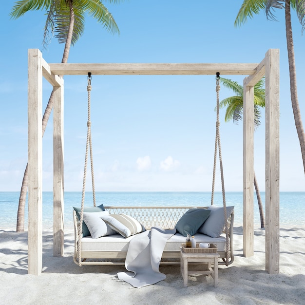 Canapé suspendu sur la plage de sable avec palmiers et vue sur la mer