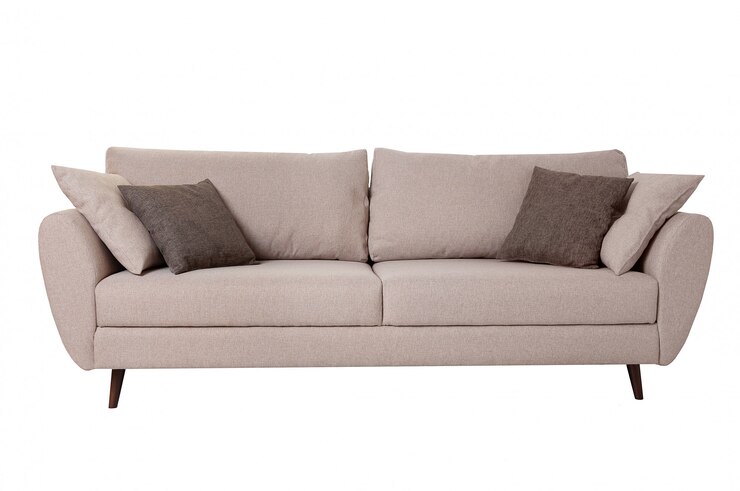 Canapé en tissu gris moderne avec des oreillers isolés sur blanc.