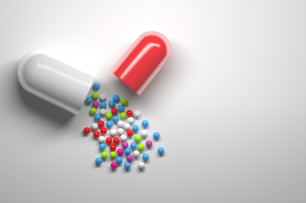Capsule de pilule ouverte avec paerticules sphériques de médicament